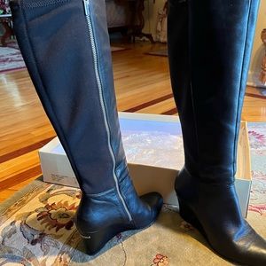 Like new Michael Kors black leather boots with wedge heel size 7.5 ,